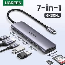 UGREEN UG-90568 7-in-1 USB-C hub with dual USB 3.0, 4K HDMI, Gigabit Ethernet, SD/TF card readers, and 100W PD charging. Complete connectivity solution.